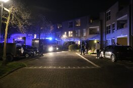 Brand in portiekwoning in Huizen