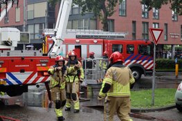 Uitslaande brand in flat in Huizen