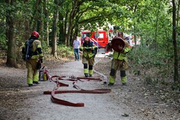 Buitenbrand in bos bij Huizen