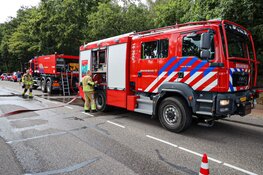Buitenbrand in bos bij Huizen