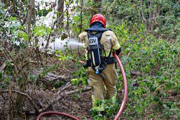 Buitenbrand in bos bij Huizen