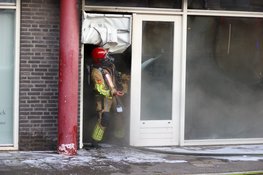 Brand in gebouw nadat man met benzinetank bezig is in Hilversum
