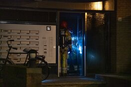 Brand in portiek, brandstichting mogelijke oorzaak