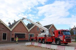 Middelbrand gebouw in Huizen