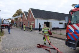 Middelbrand gebouw in Huizen